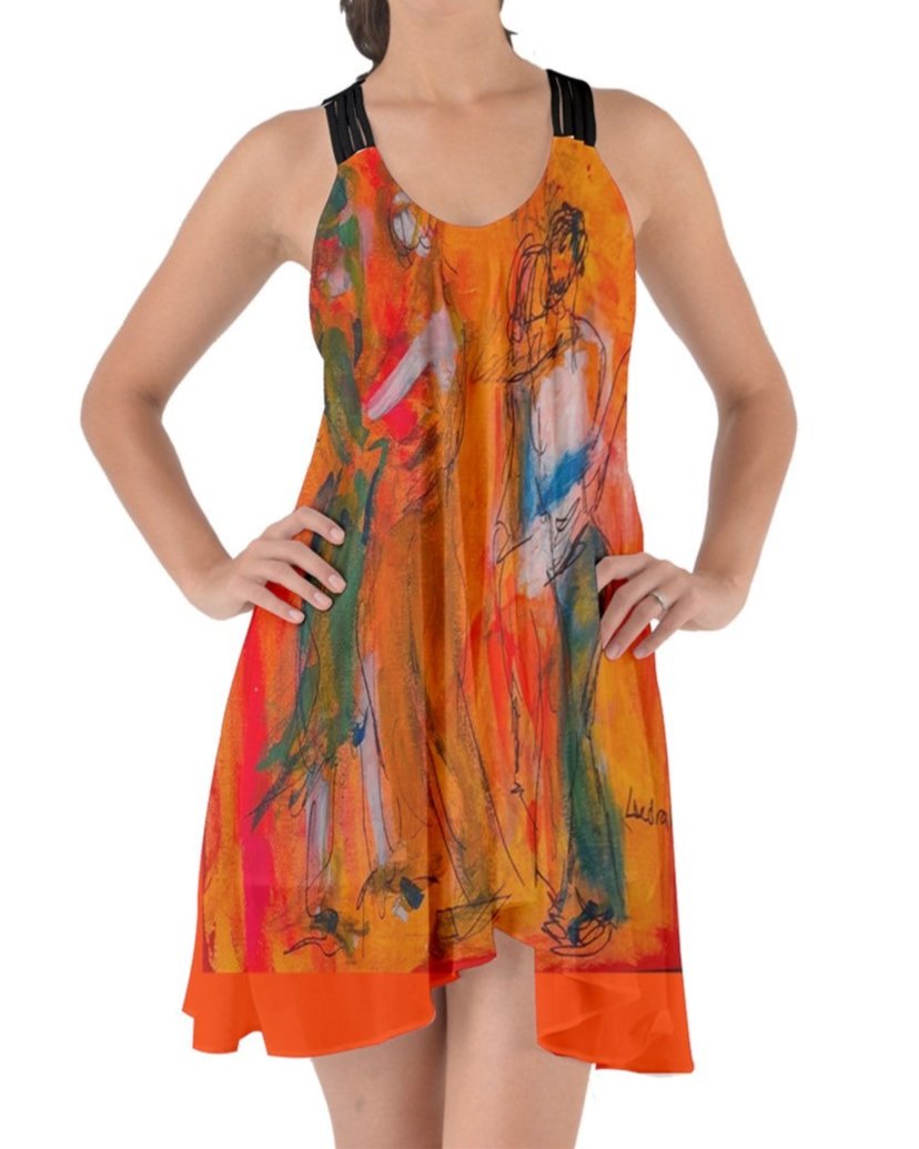 A captivating orange swirling dress featuring criss-cross back straps, adorned with original art by Leeorah. The fabric gracefully flows, accentuating movement with its seductive design .Be the star on the dance floor .Front view