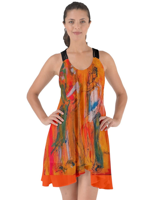 A captivating orange swirling dress featuring criss-cross back straps, adorned with original art by Leeorah. The fabric gracefully flows, accentuating movement with its seductive design .Be the star on the dance floor .Front view