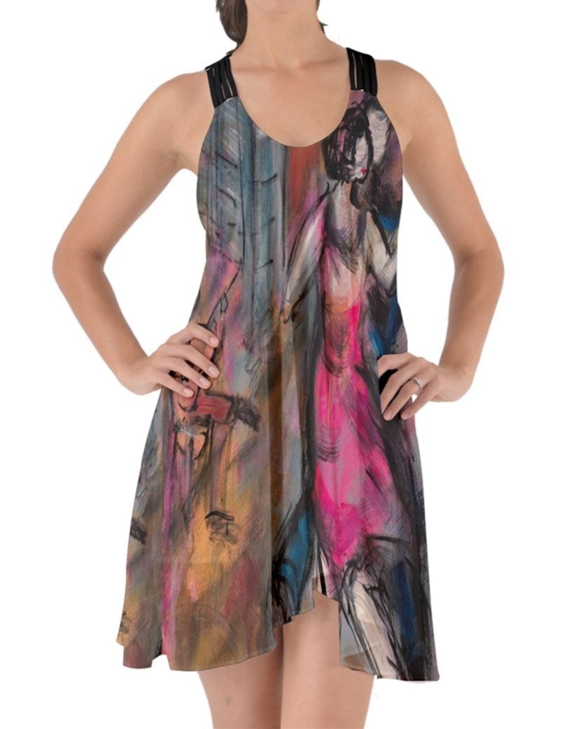 A captivating swirling dress featuring criss-cross back straps, adorned with original art by Leeorah. The fabric gracefully flows, accentuating movement with its seductive design .Be the star on the dance floor .Front view . 