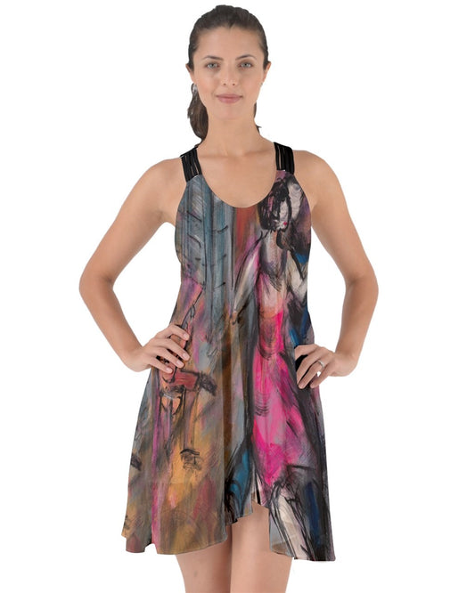 A captivating swirling dress featuring criss-cross back straps, adorned with original art by Leeorah. The fabric gracefully flows, accentuating movement with its seductive design .Be the star on the dance floor .Front view . 